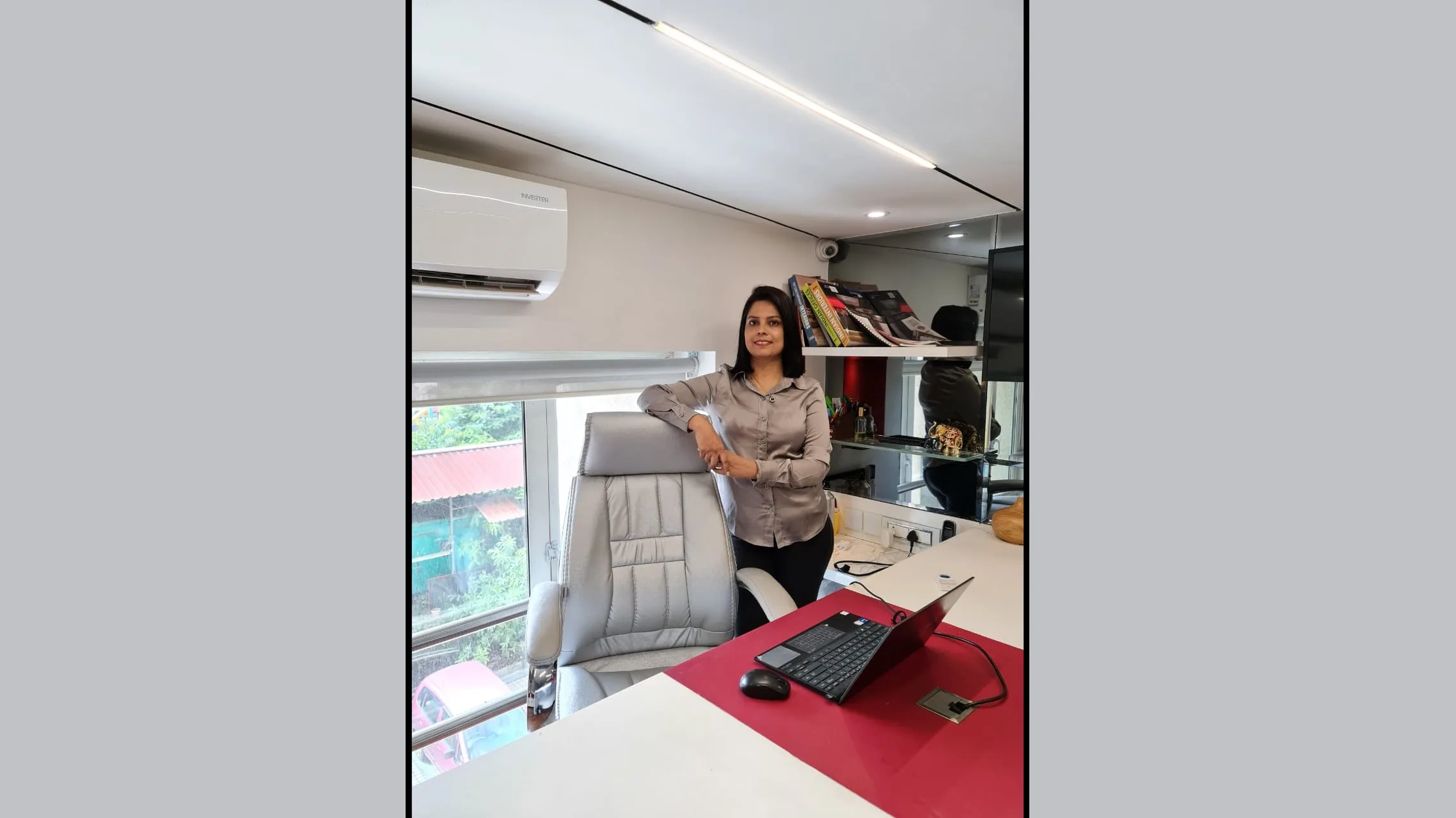 Sarika J. Kulkarni in her professionally designed office cabin by SK Design Studio